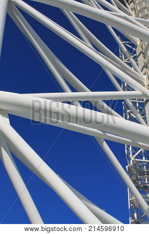 Picture of modern structure with windows and blue color background.
