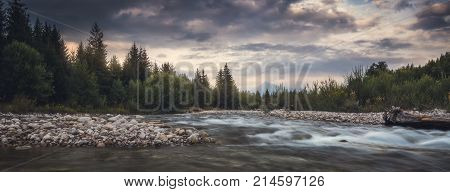 Bela River with Krivan Peak in Background at Sunset in Slovakia