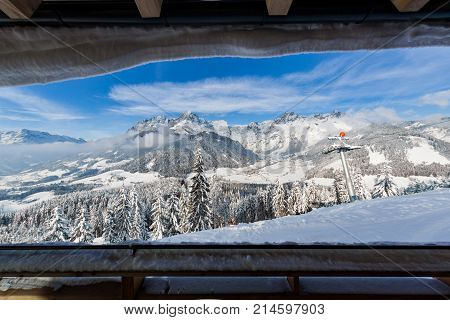 View from terrace of wooden hut on mountain in skiresort Werfenweng to Tennen mountains in Salzburg Austria