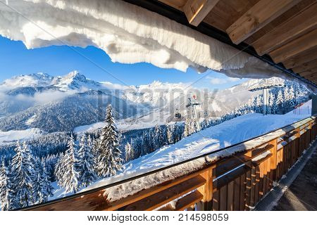 View from terrace of wooden hut on mountain in skiresort Werfenweng to Tennen mountains in Salzburg Austria