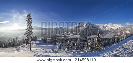 Sunset from hut on mountain in skiresort Werfenweng over winter wonderland and Tennen mountains in Salzburg Austria