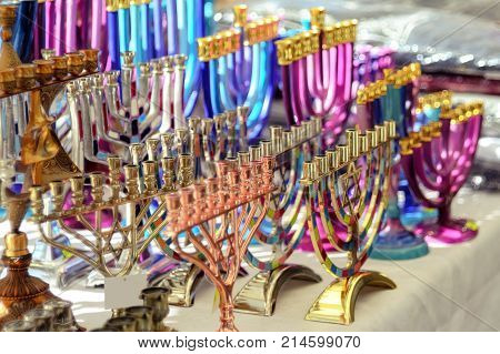 Menorah of Hanukkah (traditional candelabra) at the stand of a gift shop Netanya Israel. Jewish traditions and holidays.