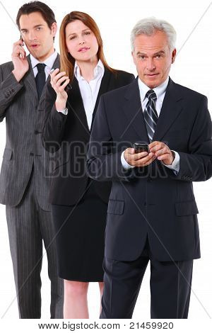 two businessman and one businesswoman with mobile