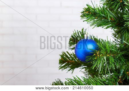 Christmas still life blue tree toy on a wooden table.