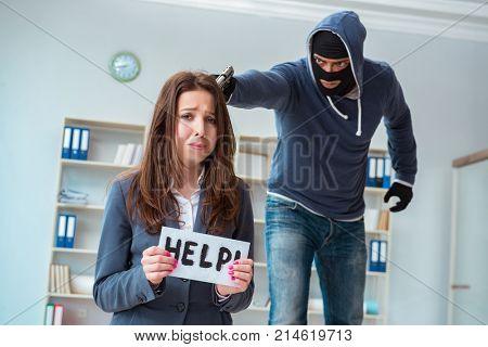 Criminal taking businesswoman as hostage in office