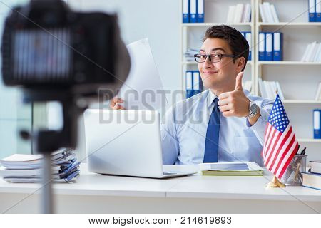 Videoblogger explaining green card visa application process