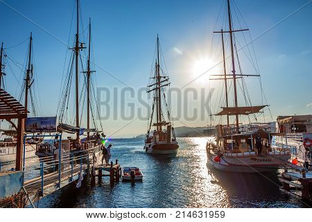 EILAT, ISRAEL - NOVEMBER 2011: Scenic view of sea pier with different yachts on sunny day