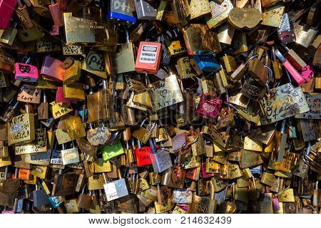 PARIS, FRANCE - CIRCA JUNE 2014: Close up love padlocks hanging on bridge