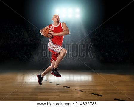 Caucassian Basketball Player in dynamic action with ball in a professional sport game