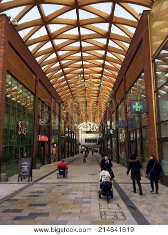 Bracknell, England - Nov 21, 2017: People passing by stores in the Lexicon shopping center, opened in 2017 as part of the ongoing redevelopment of Bracknell Town in England