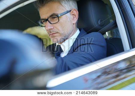  Private taxi driver driving fancy car                             