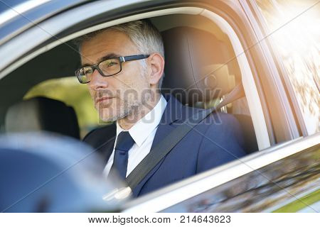  Private taxi driver driving fancy car                             