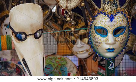 Colorful carnival masks on the market in Venice, Italy. Masks were worn in Venice to disguise the wearer from illicit activities:gambling, dancing, affairs or even political assignation
