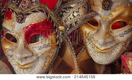Colorful carnival masks on the market in Venice, Italy. Masks were worn in Venice to disguise the wearer from illicit activities:gambling, dancing, affairs or even political assignation