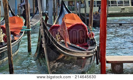 Gondola boats parking. Gondola moored, Venice, Italy. Italian gondola paddle boats docked in Venice, Veneto, Italy