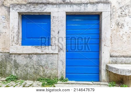 Blue Entrance Door To A House On Stone Street In Istria, Croatia