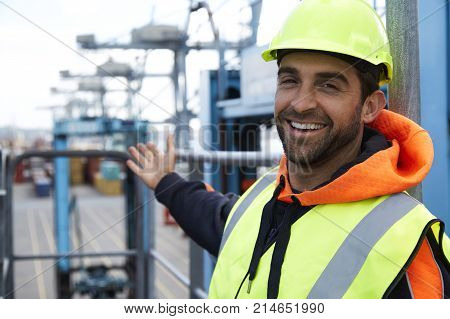 Happy docker in hardhat smiling to camera
