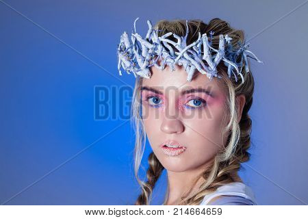 Fantasy winter queen from fairytale forest, ice makeup