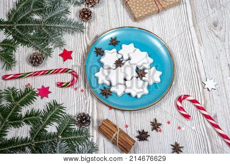 Christmas plate with cakes. background on the wooden desk