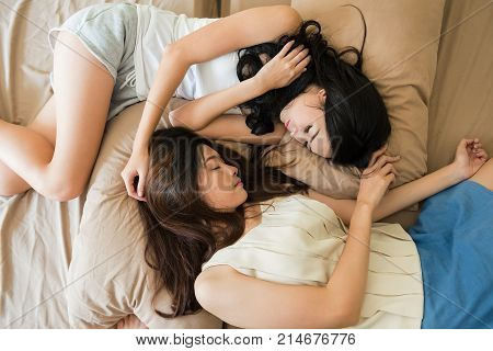 Lesbian Couple Sleep On Bed