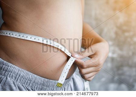 Portrait Asian fat boy concept healthy and lose weight selective and soft focus