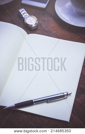Blank Paper Book On the wood working table Warm coffee Wait for creative time to start papeer blank for text background