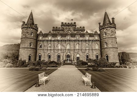 INVERARAY, SCOTLAND, UNITED KINGDOM - SEPTEMBER 8, 2015 : Inveraray Castle in western Scotland, on the shore of Loch Fyne. Vintage black and white processed.