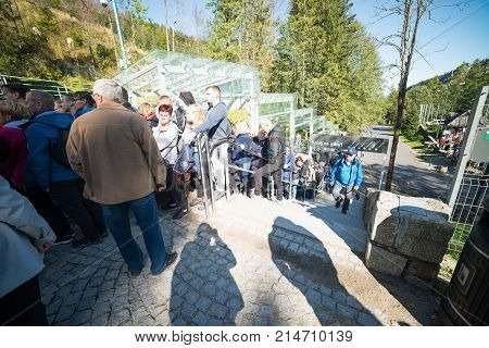 KUZNICE POLAND-SEPTEMBER 18: a large queue of people standing for tickets to the cable car on the Kasprowy Wierch Septomer 18 2017 in Zakopane Poland.