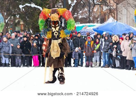 Razlog, Bulgaria - January 14, 2017: People in traditional carnival kuker costumes at Kukeri festival Starchevata