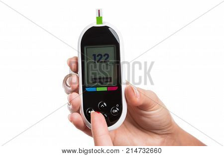 Woman Measuring Or Checking Glucose Level With Digital Glaucometer