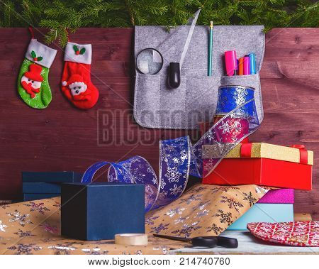 Package Christmas Gift Box. New Year Christmas Wrapping Paper, Ribbon, Bow And Thread, Scissors, Chr