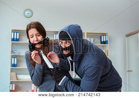 Criminal taking businesswoman as hostage in office