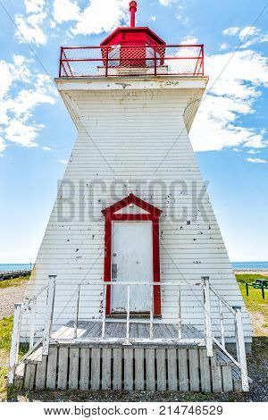 Bonaventure Village Pointe Lighthouse In Quebec, Canada Gaspesie Region With Red And White Painted C