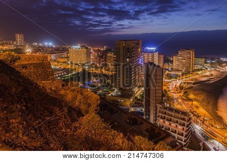 Puerto de la Cruz 2014 Panorma by night of Puerto de la Cruz in Tenerife island admiring from a view point where tourists come after dinner to see the amazing views.