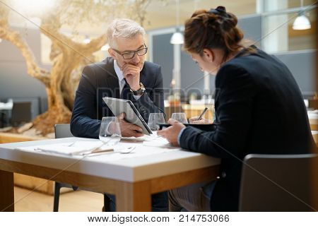 Business people in restaurant having a lunch meeting