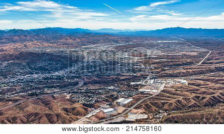 Border Wall aerial view looking into Nogales Mexico from Nogales Arizona USA