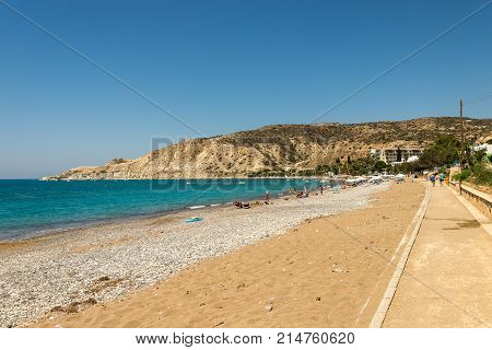 Pissouri, Cyprus, July 2017: Pissouri Bay beach with tourists relaxing in a warm sunny day between Limassol and Paphos