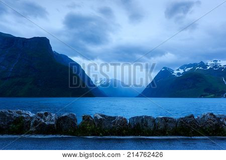 Dramatic evening view of Hjorundfjorden fjord