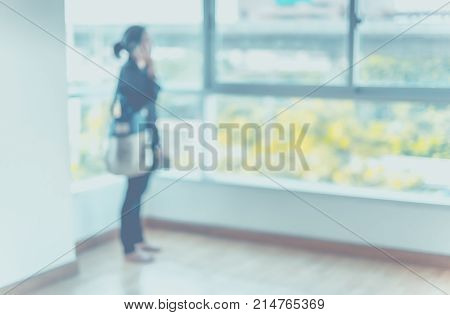Blurred Background ,woman Talk On Mobile At Condominium Room,real Eatate Agent