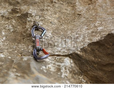 closeup of quickdraw on carbiner for rock climbing