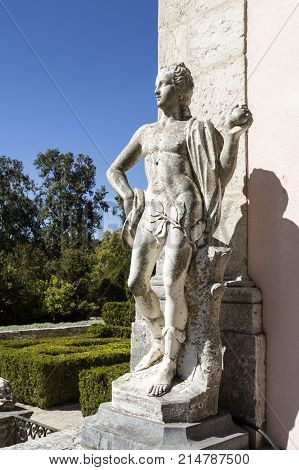 OEIRAS, PORTUGAL - September 17, 2017: Mythological statue decorating the gardens of the Palace of Marques de Pombal in Oeiras Portugal