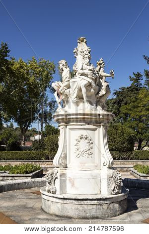 OEIRAS, PORTUGAL - September 17, 2017: Sculpture of the Four Seasons Fountain in the middle of the vegetable garden of the Palace of Marques Oeiras Portugal
