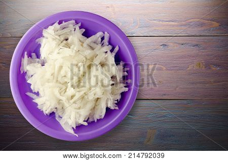 Daikon On A Wooden Background