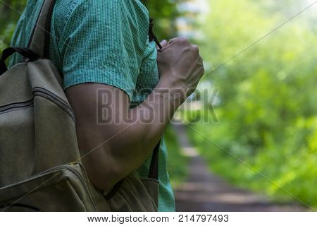 A man walks in the woods. A traveler a tourist. Summer. Autumn.