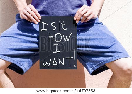 a man holds a banner reading 