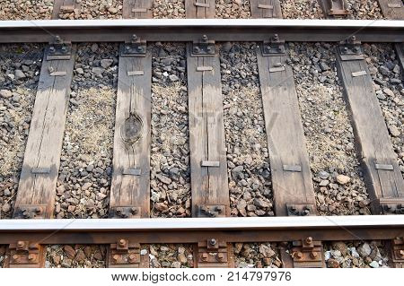 iron railway rails and wooden sleepers background