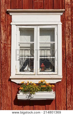 Traditional red wooden house facade in Rauma town. Finland heritage. 