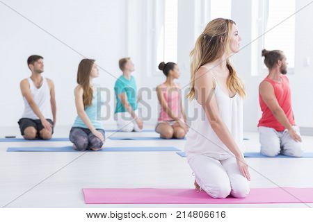 Men And Women Doing Yoga