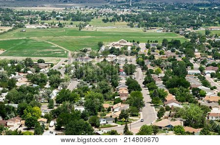 An aerial view of the outskirts of a small city.