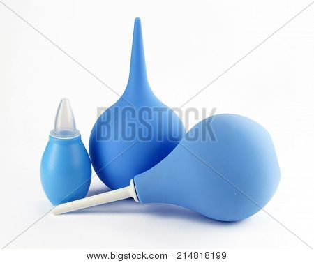 Syringe with a soft tip blue care clean closeup clyster concept